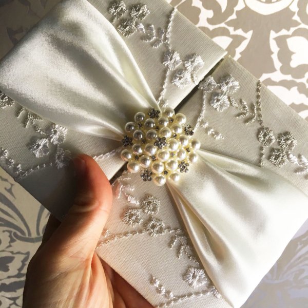 Shimmering Ivory Lace Pearl Adornment Wedding Invitation with Decorative Sash
