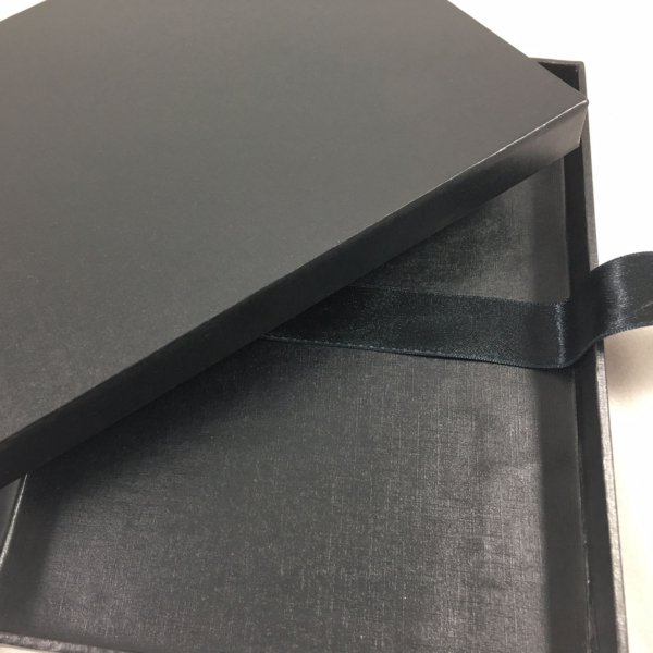 Artisanal Noir Delivery Case for Exclusive Wedding Announcements